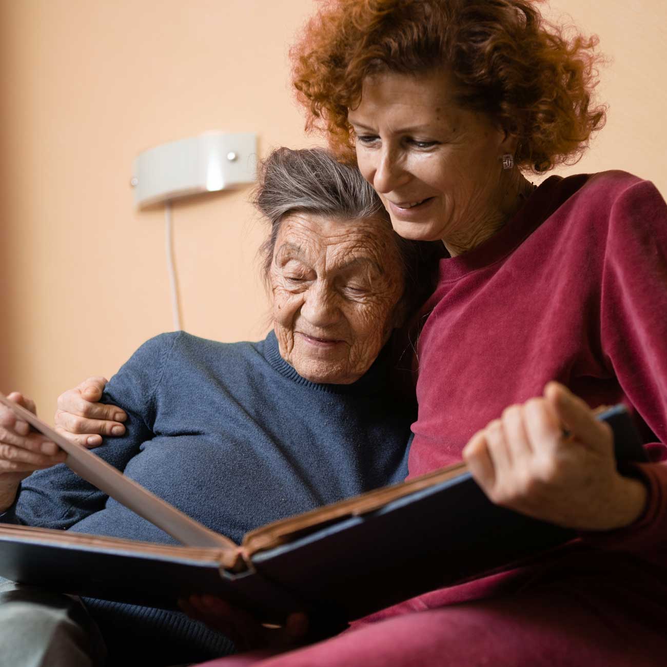 A hospice patient sharing memories with her daughter.